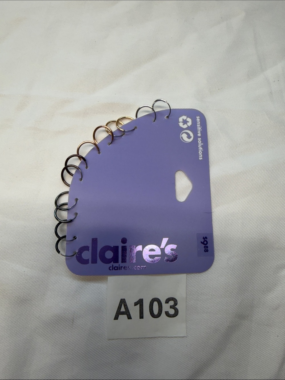 Claire's Purple Earring Display Card with Mixed Metal Rings